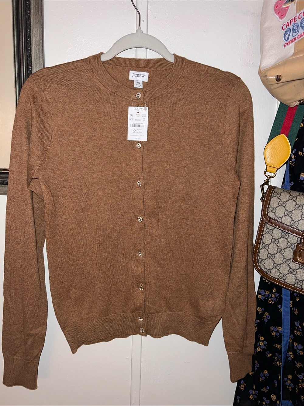 J. Crew Tan/Camel Button-Up Cardigan. Perfectly classy and goes with everything.